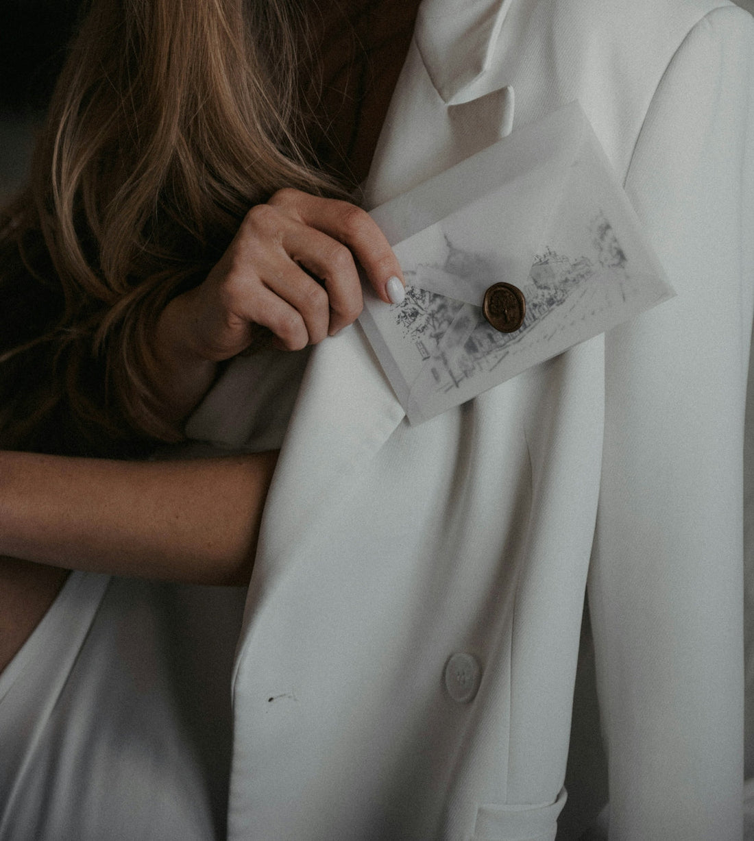 a woman wearing a white shirt and a tie